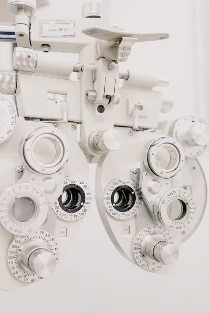 Detailed view of a phoropter used for eye exams in a modern optometry clinic.